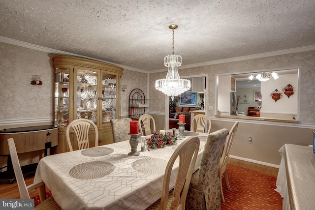 2066 Old York Rd, Burlington, NJ 08016 - dining area featuring a chandelier, wallpapered walls, wood finished floors, a textured ceiling, and crown molding