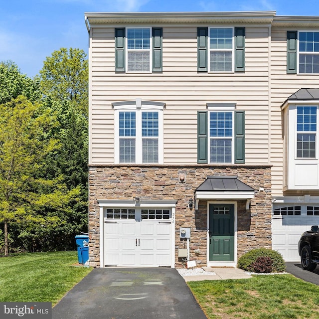 274 Macdonald Ave Unit 22, Wyncote, PA 19095 - view of property featuring a front yard, aphalt driveway, stone siding, and a garage