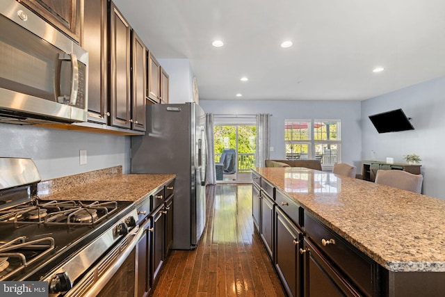 274 Macdonald Ave Unit 22, Wyncote, PA 19095 - kitchen with open floor plan, dark wood-type flooring, recessed lighting, light stone counters, and appliances with stainless steel finishes