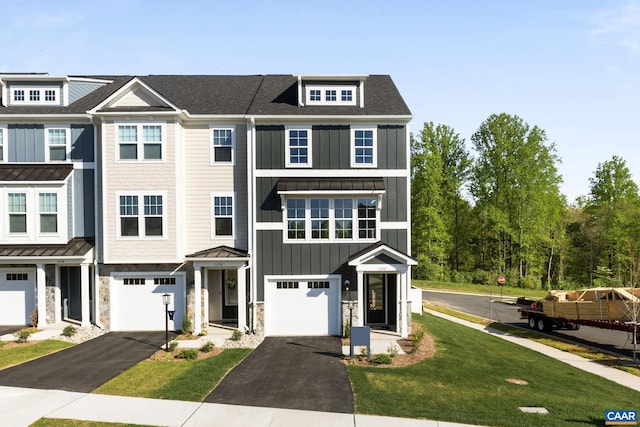 43 Farrow Cir, Charlottesville, VA 22901 - view of property with a standing seam roof, driveway, stone siding, an attached garage, and board and batten siding