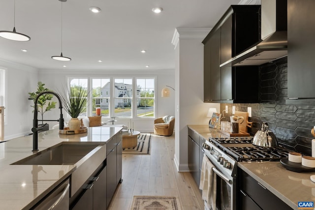 43 Farrow Cir, Charlottesville, VA 22901 - kitchen with stainless steel appliances, baseboards, light stone counters, wall chimney range hood, and ornamental molding