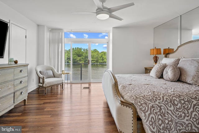 10323 Wilde Lake Ter, Columbia, MD 21044 - bedroom with access to outside, dark wood-type flooring, a water view, a ceiling fan, and a wall of windows