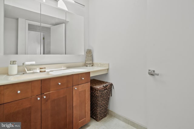 10323 Wilde Lake Ter, Columbia, MD 21044 - bathroom with vanity, tile patterned flooring, and baseboards