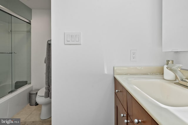 10323 Wilde Lake Ter, Columbia, MD 21044 - bathroom featuring vanity, toilet, enclosed tub / shower combo, and tile patterned flooring