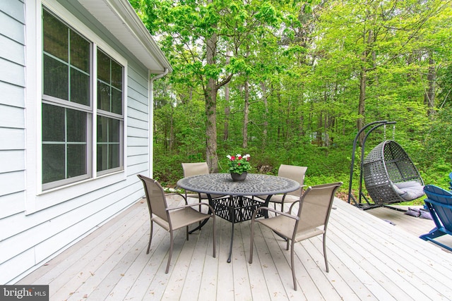 wooden deck with outdoor dining area