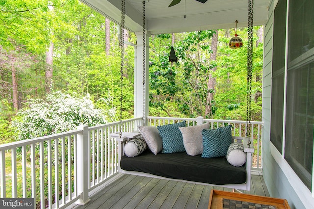 wooden deck featuring ceiling fan