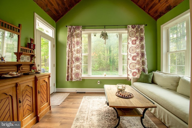 interior space with a healthy amount of sunlight, wood ceiling, and vaulted ceiling