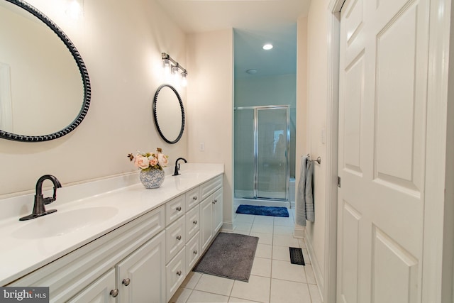 bathroom with double vanity, tile patterned flooring, a stall shower, a sink, and recessed lighting