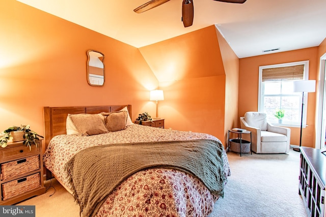 bedroom featuring carpet, a ceiling fan, and visible vents