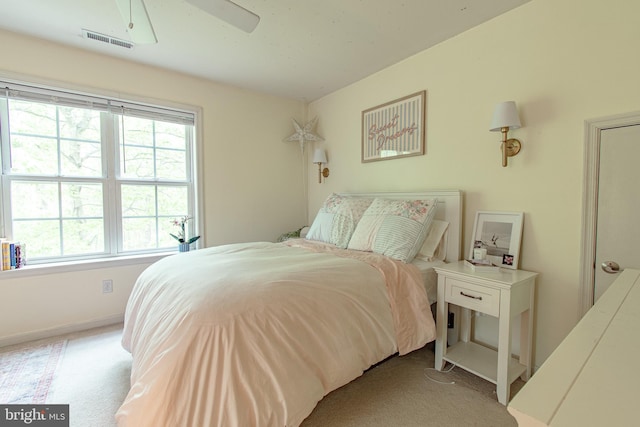 bedroom featuring carpet flooring, baseboards, visible vents, and ceiling fan