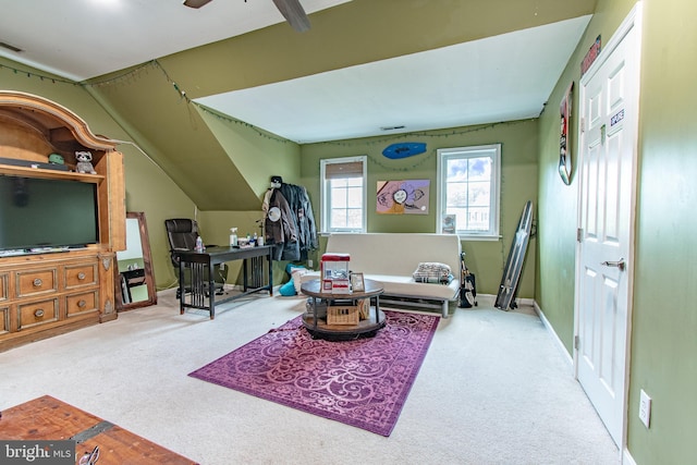 interior space featuring ceiling fan and carpet flooring