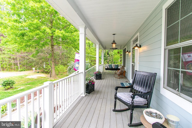 wooden deck featuring covered porch