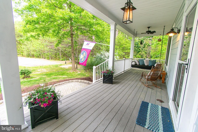 wooden terrace featuring covered porch