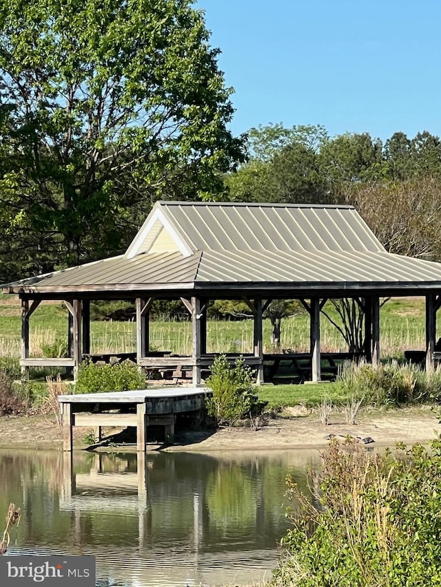 surrounding community featuring a water view