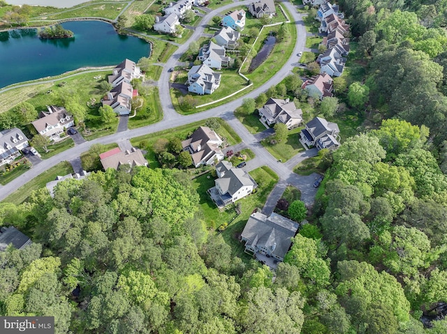 birds eye view of property featuring a residential view and a water view