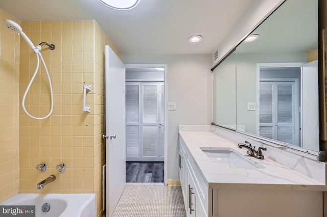 bathroom featuring tile patterned floors, visible vents, recessed lighting, vanity, and tub / shower combination