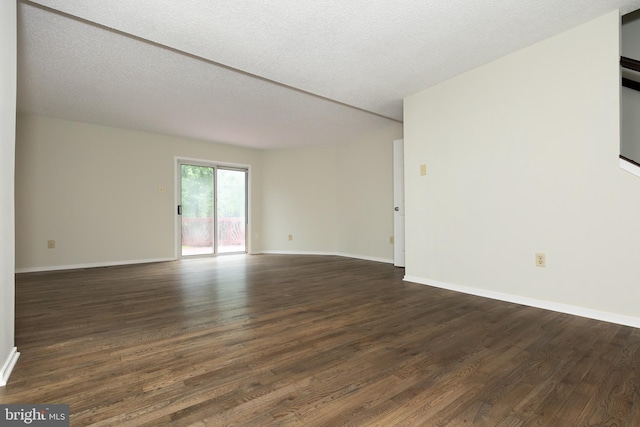 19320 Liberty Heights Ln, Germantown, MD 20874 - unfurnished room with dark wood finished floors and a textured ceiling