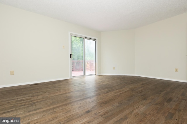 19320 Liberty Heights Ln, Germantown, MD 20874 - spare room with dark wood-style flooring and baseboards