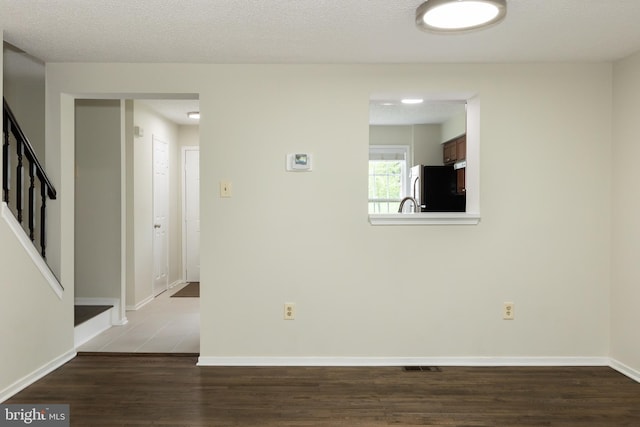 19320 Liberty Heights Ln, Germantown, MD 20874 - empty room featuring wood finished floors and stairway