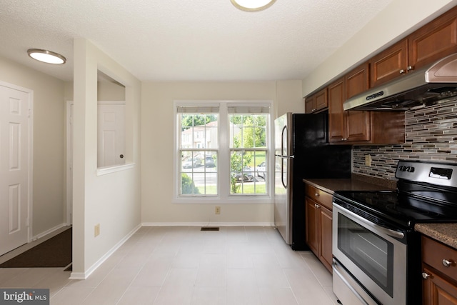 19320 Liberty Heights Ln, Germantown, MD 20874 - kitchen with appliances with stainless steel finishes, range hood, tasteful backsplash, brown cabinetry, and dark countertops