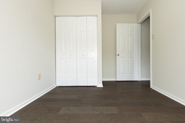 19320 Liberty Heights Ln, Germantown, MD 20874 - unfurnished bedroom featuring dark wood-type flooring and a closet