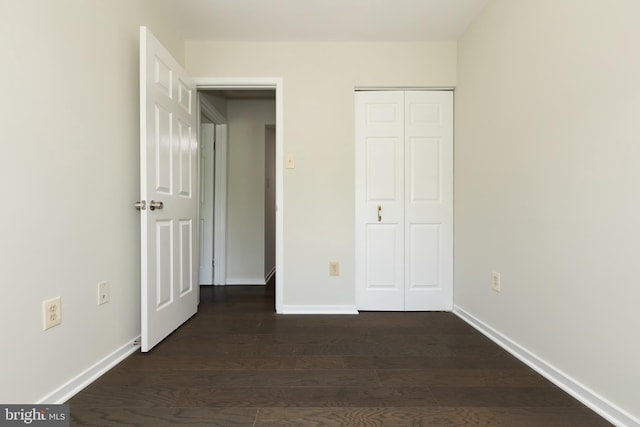 19320 Liberty Heights Ln, Germantown, MD 20874 - unfurnished bedroom featuring dark wood finished floors and a closet