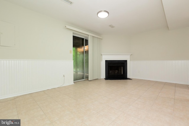 19320 Liberty Heights Ln, Germantown, MD 20874 - unfurnished living room featuring wainscoting and a fireplace with flush hearth