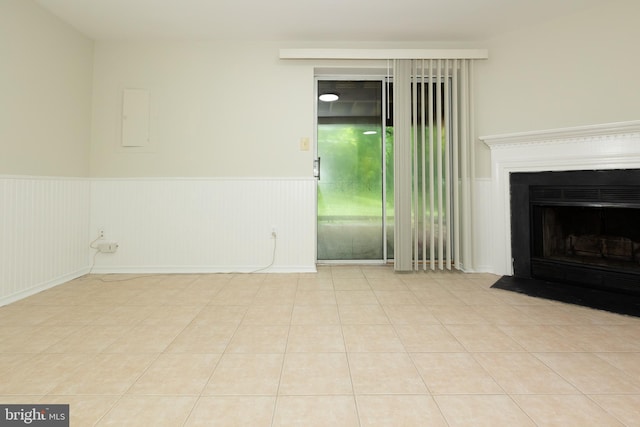 19320 Liberty Heights Ln, Germantown, MD 20874 - unfurnished living room featuring a wainscoted wall, a fireplace with flush hearth, and electric panel