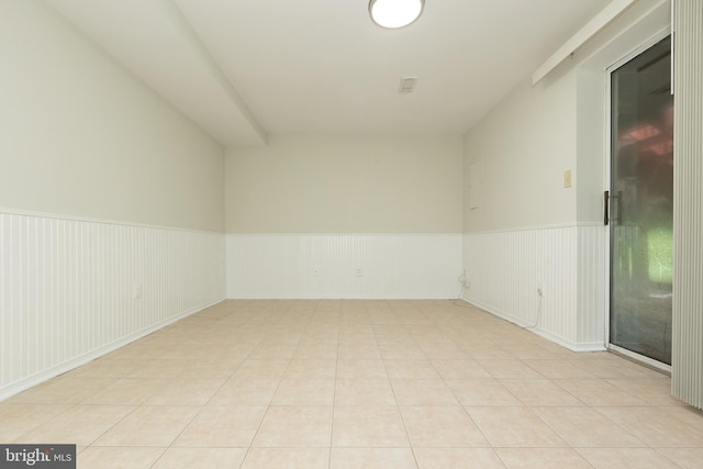 19320 Liberty Heights Ln, Germantown, MD 20874 - spare room with a wainscoted wall and light tile patterned floors