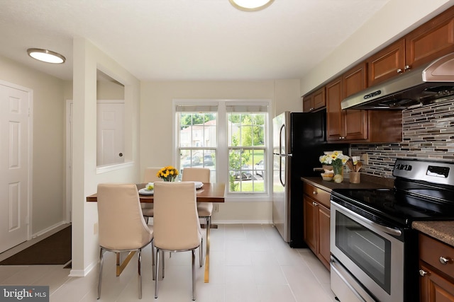 19320 Liberty Heights Ln, Germantown, MD 20874 - kitchen with appliances with stainless steel finishes, exhaust hood, decorative backsplash, brown cabinets, and dark countertops