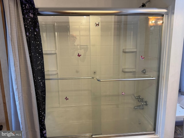full bath with bath / shower combo with glass door