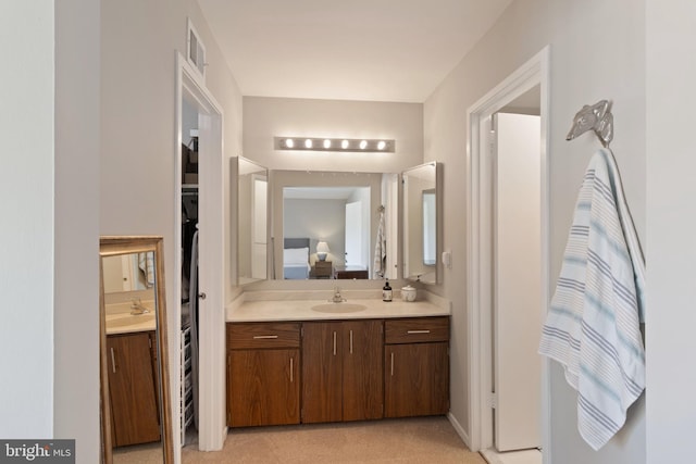 full bathroom with vanity, ensuite bath, and visible vents