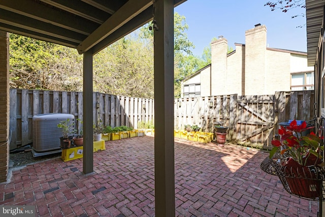 view of patio / terrace featuring central AC unit and a fenced backyard
