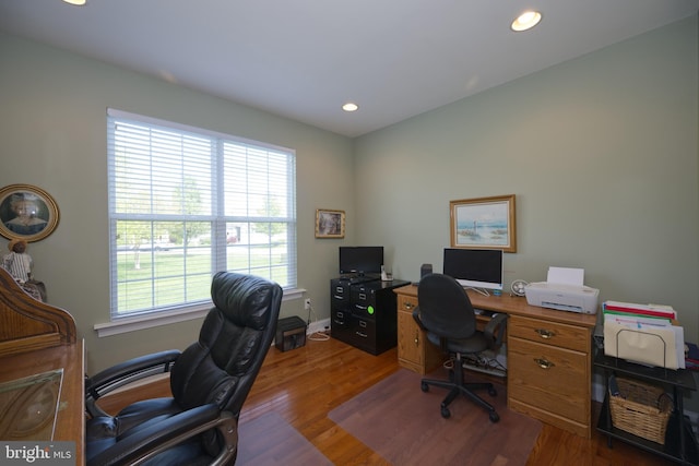 office space with recessed lighting, wood finished floors, and baseboards