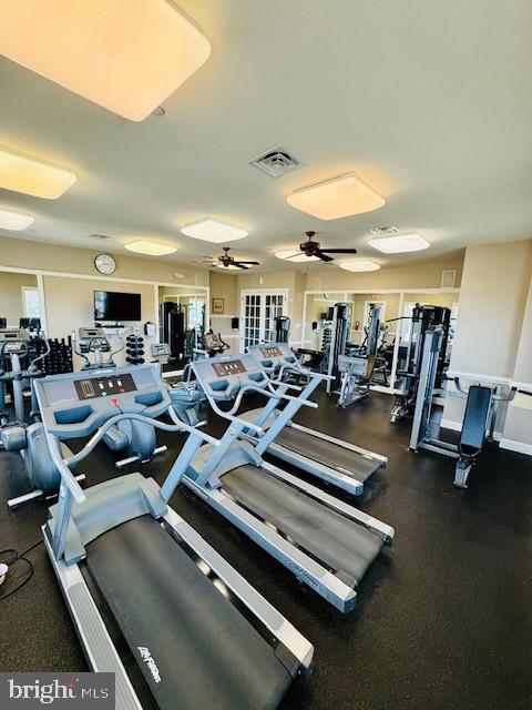workout area featuring visible vents and ceiling fan