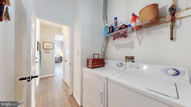 43295 Ardmore St, Ashburn, VA 20147 - washroom featuring light wood-style floors, laundry area, and independent washer and dryer