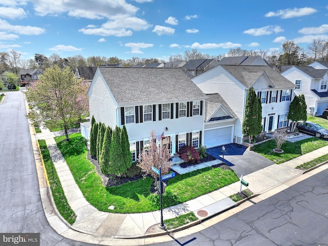 43295 Ardmore St, Ashburn, VA 20147 - view of front of home featuring a residential view, driveway, and roof with shingles
