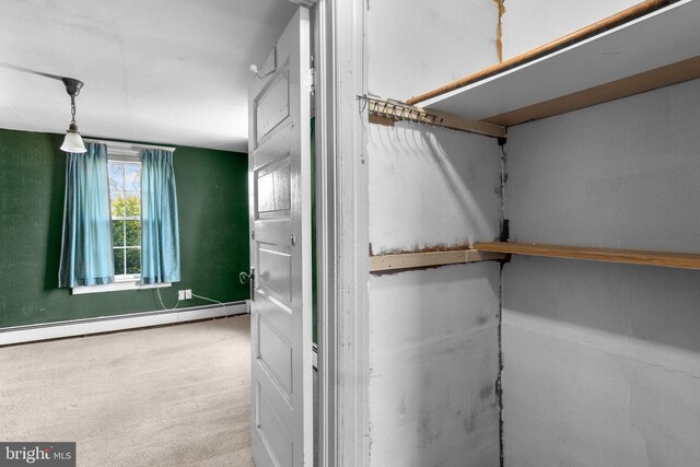 interior details featuring carpet, baseboards, and baseboard heating