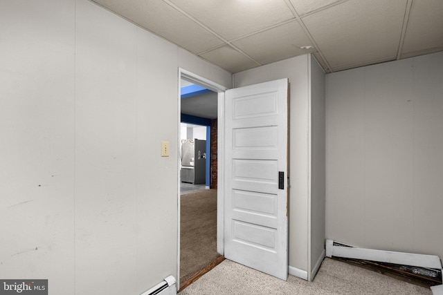 interior space with a baseboard radiator and light colored carpet