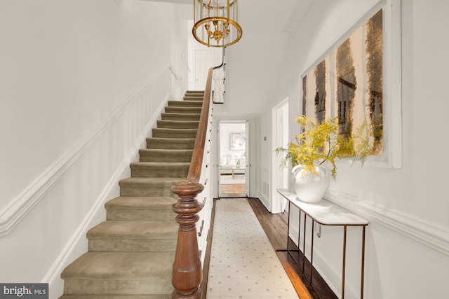 700 6th St SE, Washington, DC 20003 - stairs featuring a chandelier, wood finished floors, and a high ceiling