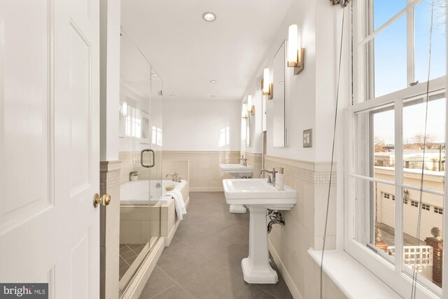 700 6th St SE, Washington, DC 20003 - full bath featuring a stall shower, tile patterned floors, a garden tub, and a healthy amount of sunlight