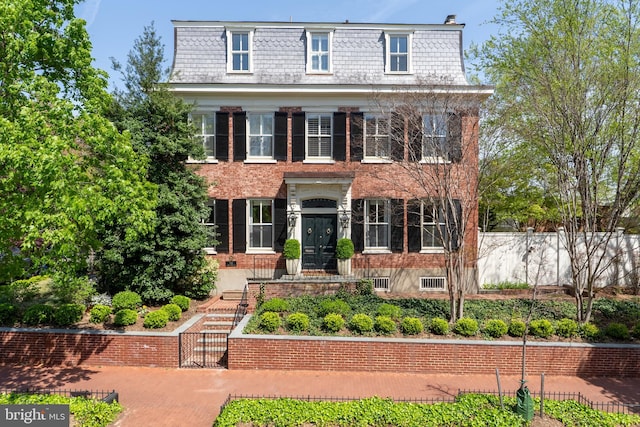 700 6th St SE, Washington, DC 20003 - view of front of home with a gate, fence, a high end roof, mansard roof, and brick siding