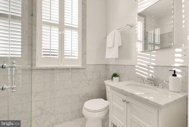 700 6th St SE, Washington, DC 20003 - full bathroom with toilet, vanity, tile walls, wainscoting, and walk in shower