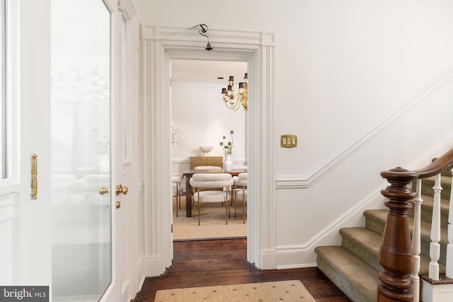 700 6th St SE, Washington, DC 20003 - stairs featuring wood finished floors, a notable chandelier, and ornamental molding