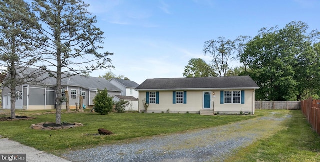 21 Thorn St, Magnolia, DE 19962 - single story home featuring a front yard, driveway, entry steps, and fence