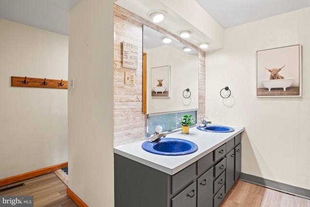 1008 N Ridge Rd, Perkasie, PA 18944 - full bathroom featuring a sink, wood finished floors, and baseboards