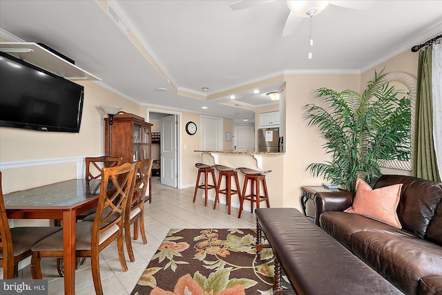 4201 Coastal Hwy Unit 116, Ocean City, MD 21842 - living room featuring crown molding, baseboards, a ceiling fan, and light tile patterned floors