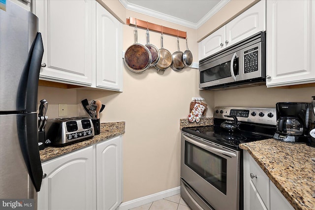 4201 Coastal Hwy Unit 116, Ocean City, MD 21842 - kitchen featuring ornamental molding, appliances with stainless steel finishes, white cabinets, and light tile patterned floors