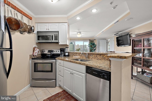 4201 Coastal Hwy Unit 116, Ocean City, MD 21842 - kitchen with a peninsula, a sink, light tile patterned flooring, appliances with stainless steel finishes, and ornamental molding