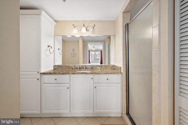 4201 Coastal Hwy Unit 116, Ocean City, MD 21842 - full bathroom with a shower stall, a ceiling fan, vanity, and tile patterned floors